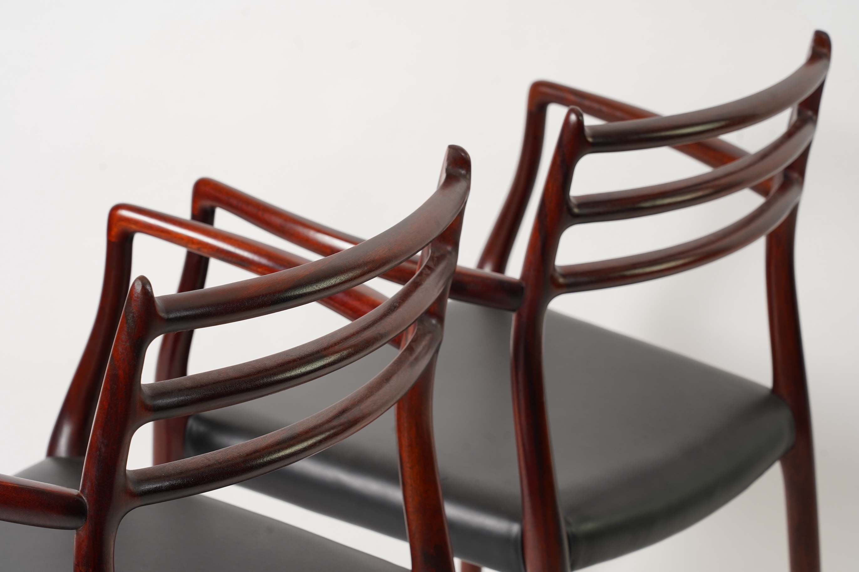 Niels Otto Møller (Danish, 1920-1982) for JL Møllers Møbelfabrik: A pair of 'Model 62' carver chairs
